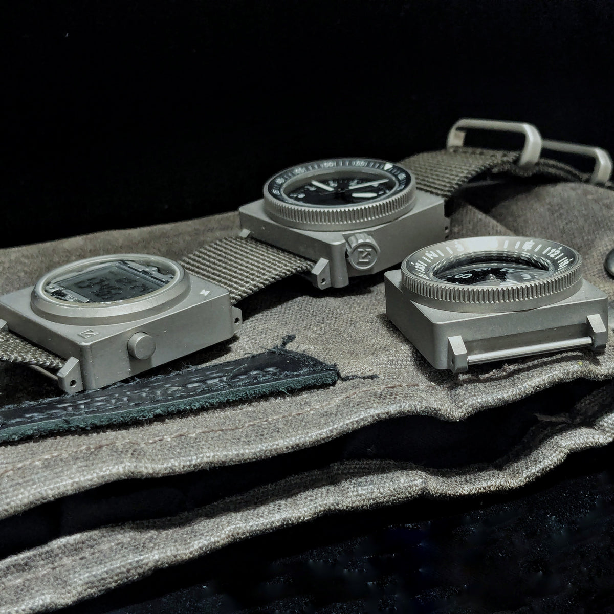 SCOUT automatic, digital and compass instruments on a canvas roll.