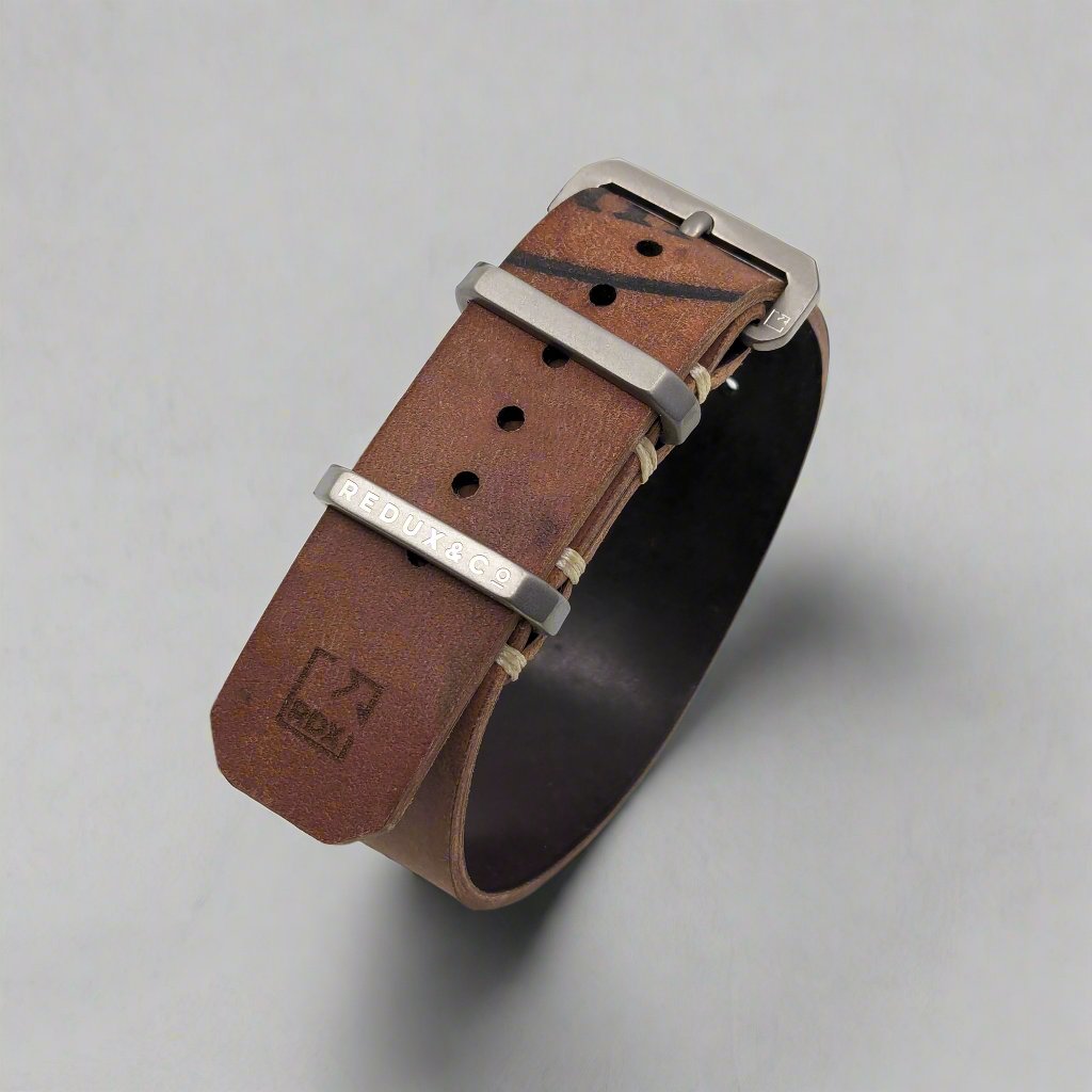 Solid titanium buckle and keepers on reverse Horween shell cordovan watch strap