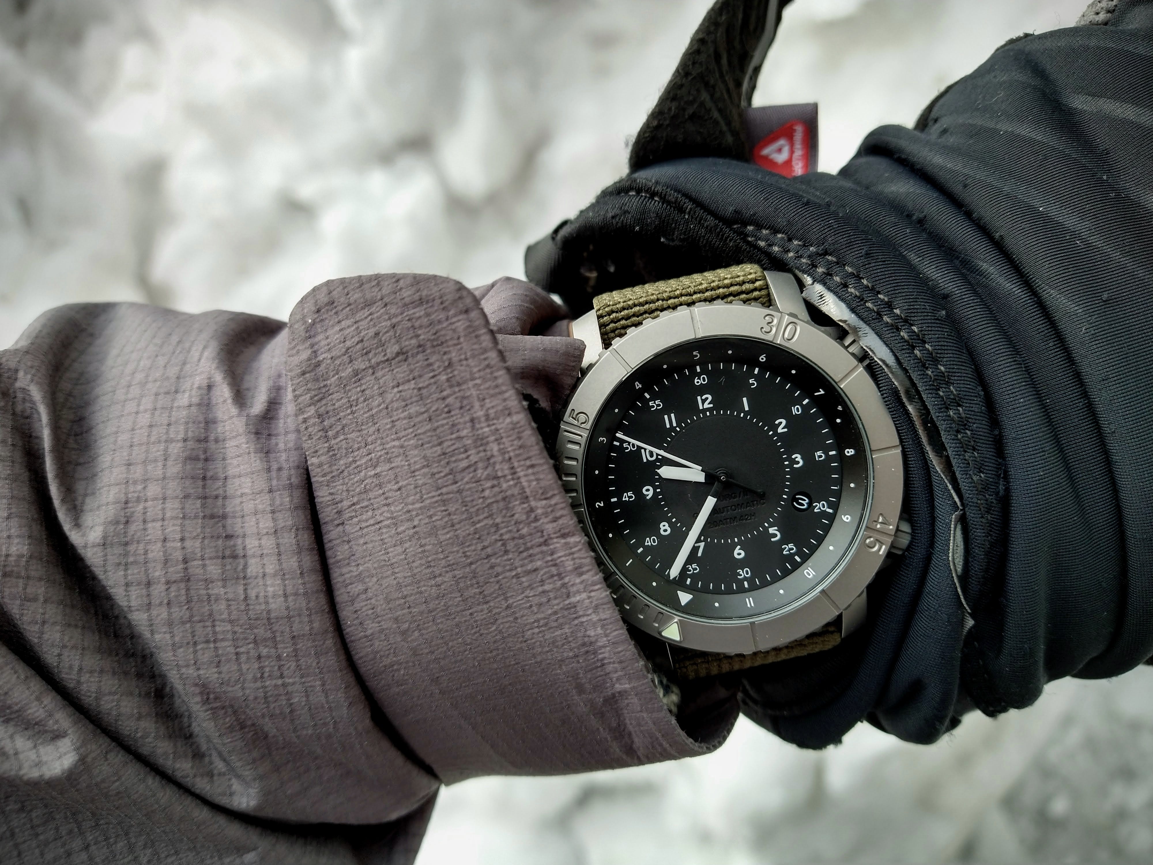 COURG42 GCT titanium watch worn over winter gloves