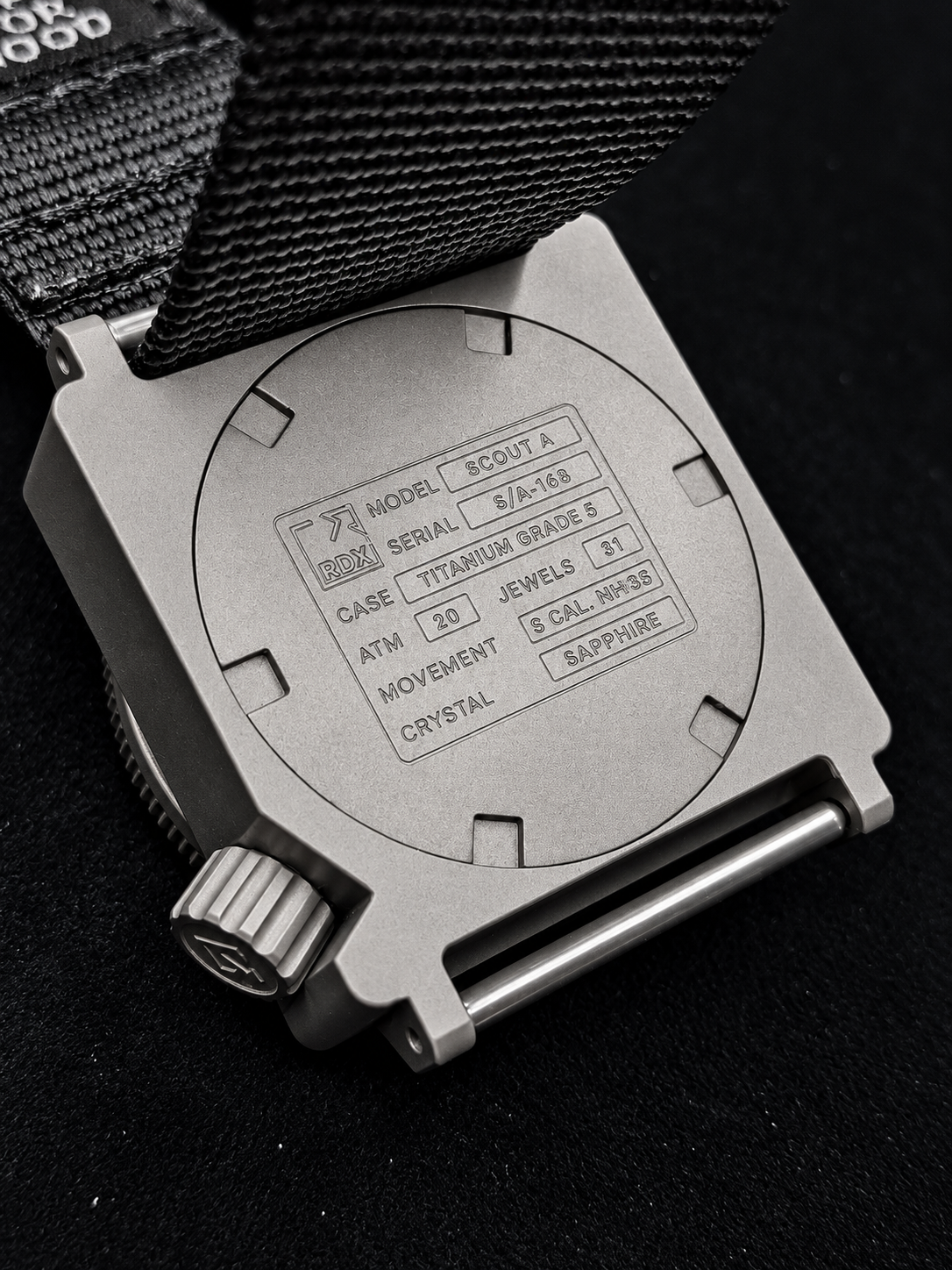 SCOUT Grade 5 titanium caseback with model, water resistance, movement and sapphire markings.