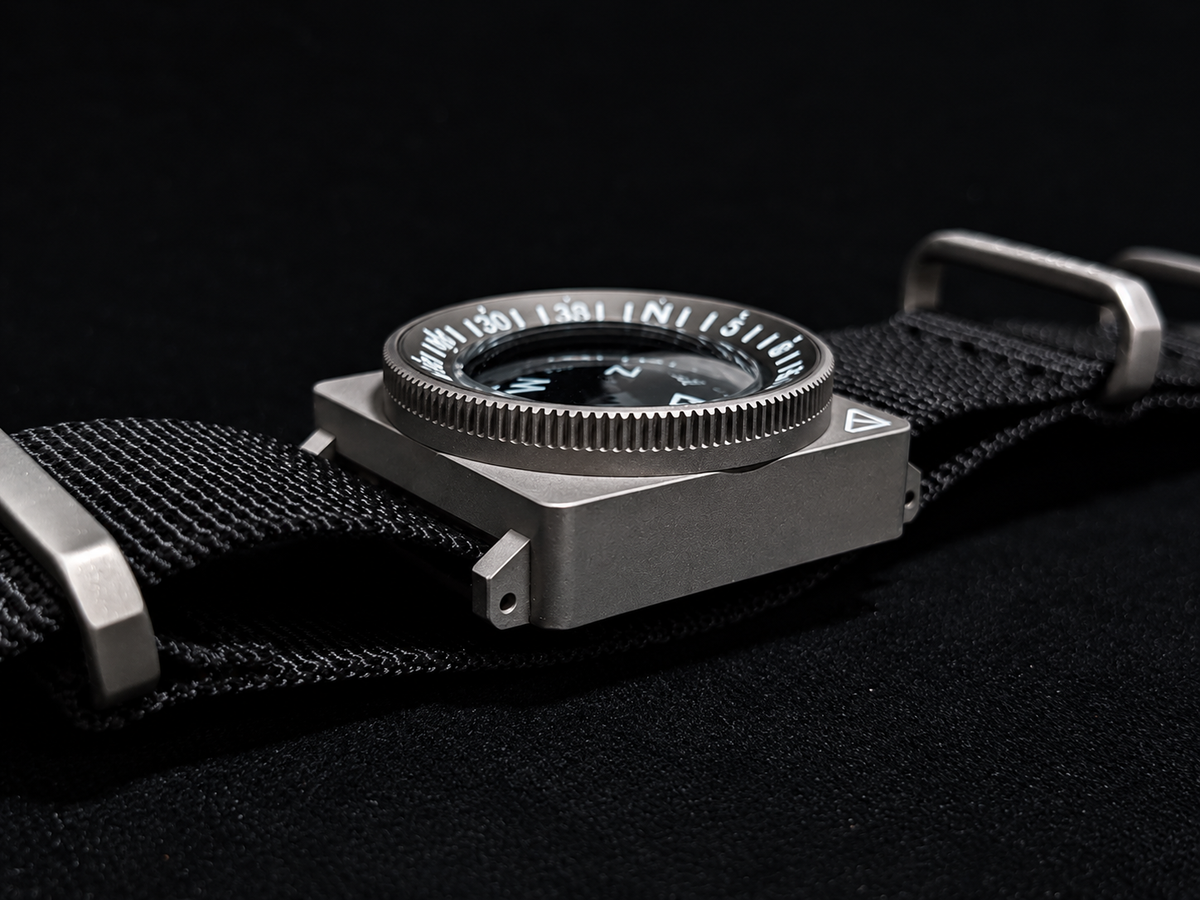 SCOUT compass showing the case and rotating bearing bezel in profile.