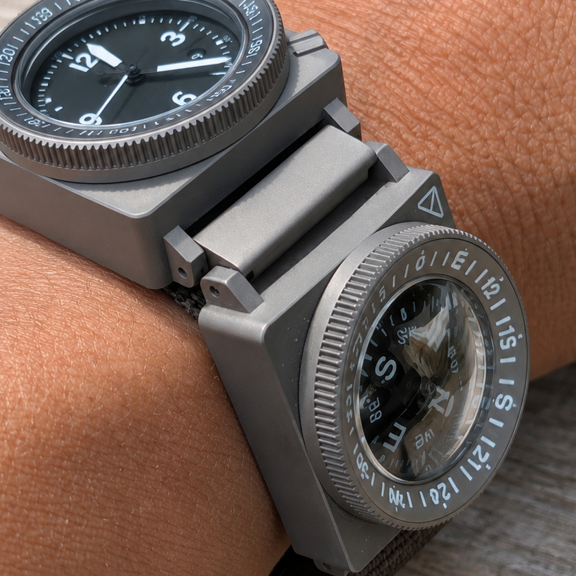 SCOUT A-9 Automatic and Compass connected by a titanium link on wrist.
