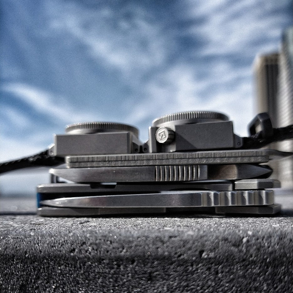 Side profile of SCOUT titanium instruments, showing the case, crown, bezels and connector hardware.